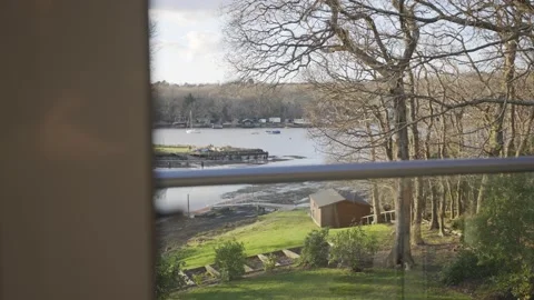 A view of a lake with a house in the background Stock Footage 302441844