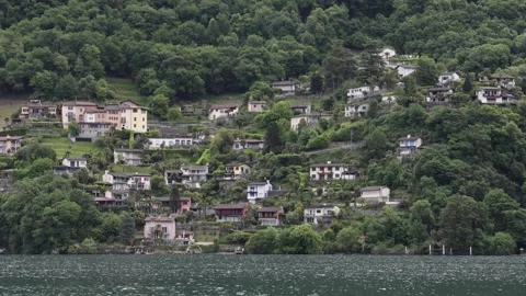View of Lake Lugano and hillside houses in Switzerland. 스톡 동영상 343670834