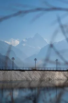 View of lake with nanda devi peak on a bright sunny day in Uttarakhand Stock Photos