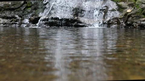 View of lake before waterfall close up Stock Footage 151350226