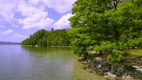 View of the lakeshore at Kochelsee Stock Footage 339560127