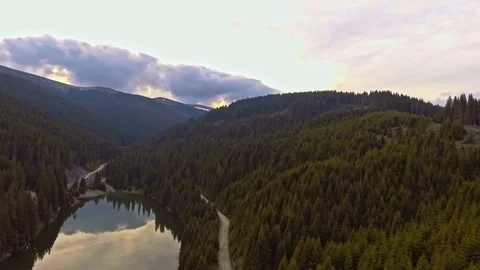 View from the lakeside at the foothills of the Bucegi mountain range Stock Footage 75944798