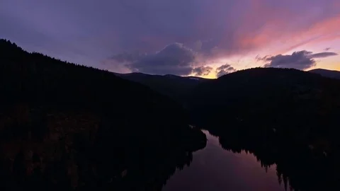 View from the lakeside at the foothills of the Bucegi mountain range Stock Footage 75944985