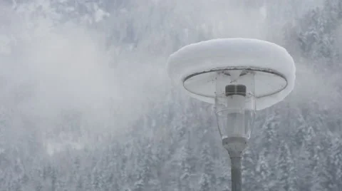 View of a lamp post covered with snow in Hallstatt Stock Footage 61472004