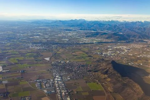 View of the land surface from a window of the plane flying at big height Stock Photos