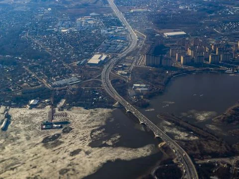 View of the land surface from a window of the plane flying at big height, Moscow Stock Photos