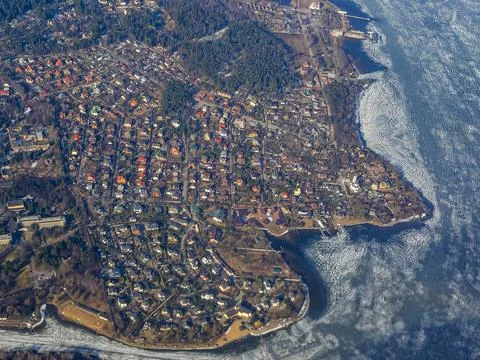 View of the land surface from a window of the plane flying at big height, Moscow Stock Photos
