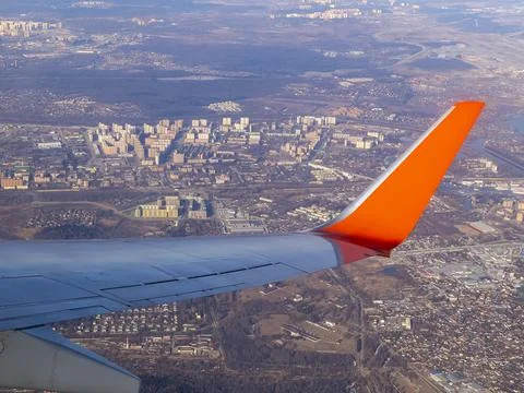 View of the land surface from a window of the plane flying at big height, Moscow Stock Photos
