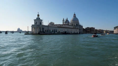 View of landmark building while sailing out of Venice, Italy on a sunny day Stock-Footage 132039831