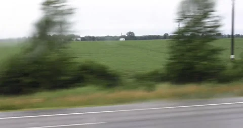 View of the landscape in cloudy weather outside the window while driving a b Stock Footage 338270718
