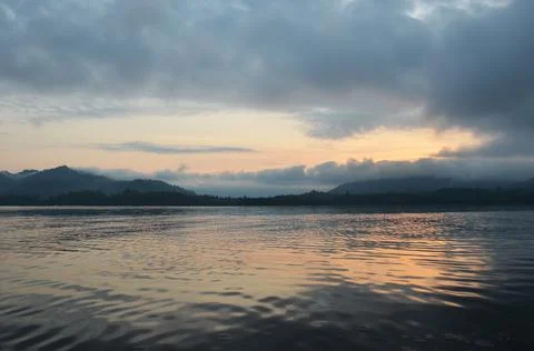 View landscape mountain and reflection and wave on surface water of Songkalia Stock Photos
