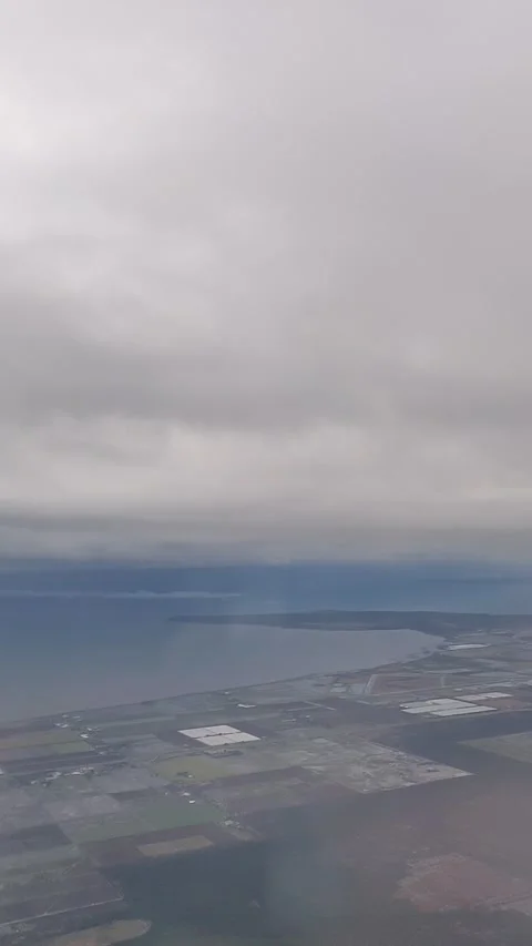 View of Landscape Through Airplane Window Glass Stock Footage 168905778