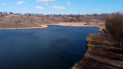 View of the landscape from the top flying upon the lakes. Early spring in rural Stock Footage 126921360