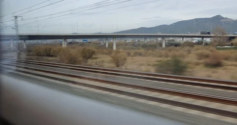 View of a landscape from the window of a train Stock Footage 104077491
