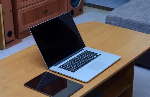 View on a laptop pc and a tablet on a desk in a home office Stock Photos
