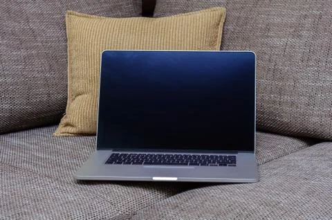 View on a laptop pc on the sofa in a home office Stock Photos