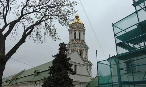 View of the large bell tower and the facade of the Trinity Gate Church 库存照片