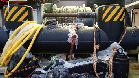 View of large bollard and windlass with cables on ship deck Stock Footage 72407125