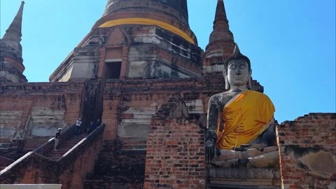 View of large Buddha statue draped in yellow robes in Ayutthaya, Thailand. Stock Footage 308959049