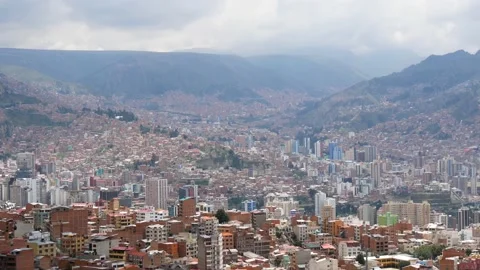 View Of A Large City In The Mountains With Dense Buildings Between The Ridges Stock Footage 171656083