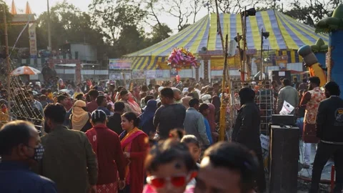 View of a large crowd at a fair with a circus tent, Bangladesh. Video stock 335015825
