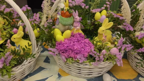  A view of the large Easter baskets with flowers and bunnies in a row on a large Stock Footage 306824458