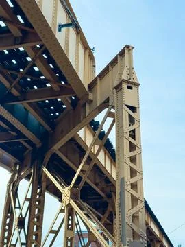 View of a large elevated train structure with metal beams and supports on a.. Foto stock