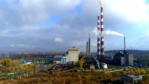 View to large factory with high tower and smoke Stock Footage 321132936