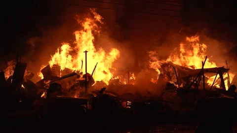 View of a large fire burning in Khagrachari, Bangladesh. Video stock 335562480