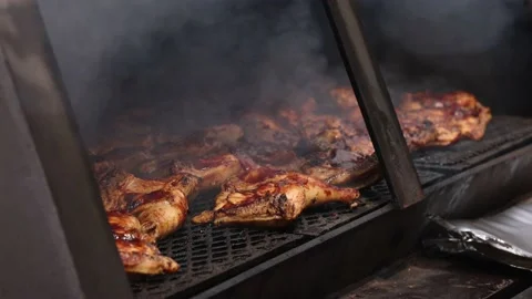View Of Large Grill Filled With Barbecue Chicken Close Lid Video stock 233457292