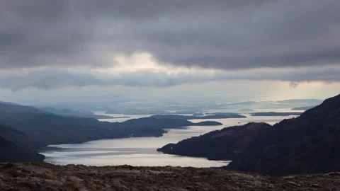 View Of Large Lakes And Hills On A Cloudy Day (Loch Lomond, Scotland) Stock Footage 283919485