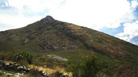 View of a large mountain that was previously a snowy mountain and now no longer Stock Footage 164596240