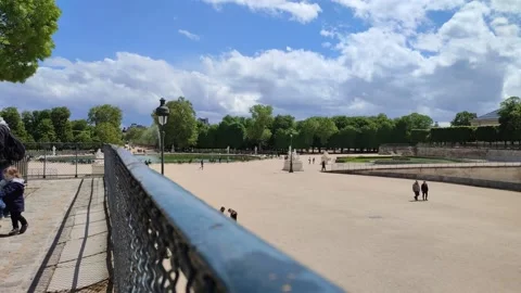 View of a large park area with walking people in Paris Stock Footage 154794286