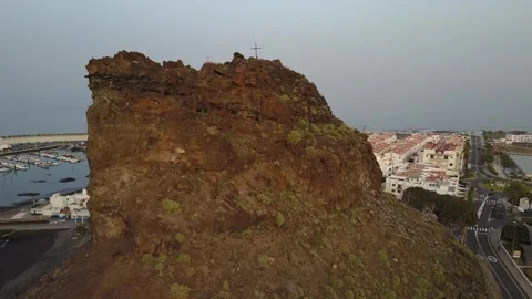 View of a large rock in front of a port in the Canary Islands Stock Footage 300553965