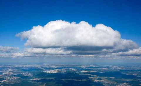 View of a large white cloud from an airplane window Stock Photos