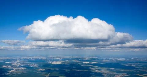 View of a large white cloud from an airplane window Stock Photos