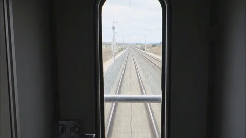 View of the last car window of the train. high-speed train Stock Footage 121988420