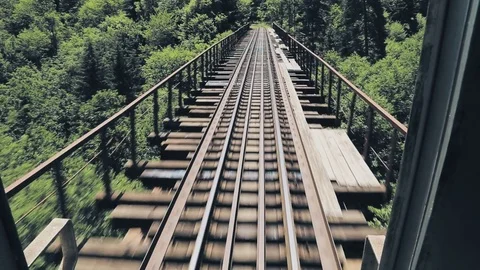 View from the last train car to the rails and bridge Stock Footage 79458962