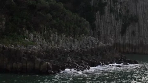 View of lava, basalt columns with blacksea. Stock Footage 234618598
