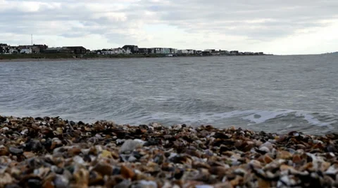 View of Lee-on-the-Solent from around the curved stoney beach. Calm sea Stock Footage 45592215