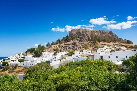 View of lemon trees and Acropolis of Lindos (Rhodes, Greece) Stock Photos