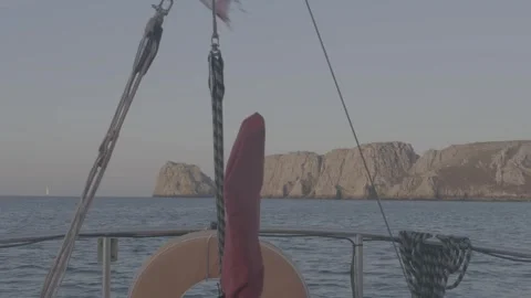 View of Les Tas de Pois cliffs from a sailboat at anchor, Camaret, Brittany Stock Footage 330675649