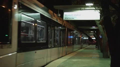 View of Light Rail train in Houston museum district. Stock Footage