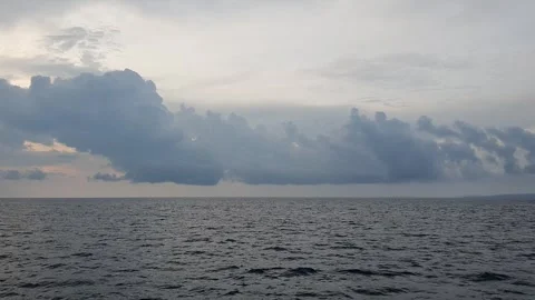 View of light reflection between clouds above the sea Stock Footage 297241463