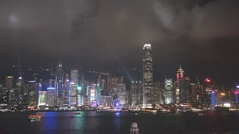 View of the light show on a busy night featuring the skyline of Hong Kong. Stock Footage 118797794