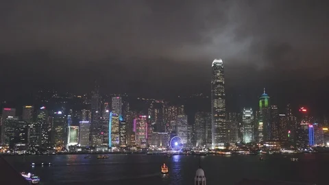 View of the light show on a busy night featuring the skyline of Hong Kong. Stock Footage 118797914