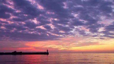 View of the lighthouse at dawn standing on the coast Stock Footage 84809175