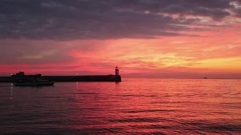 View of the lighthouse at dawn standing on the coast Stock Footage 84809389