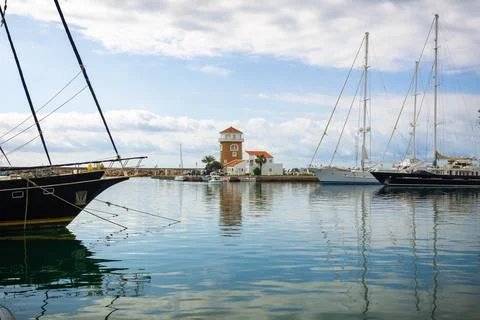 View of the lighthouse from the port Stock Photos