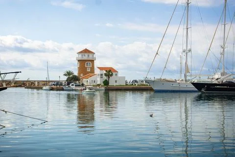 View of the lighthouse from the port Stock Photos